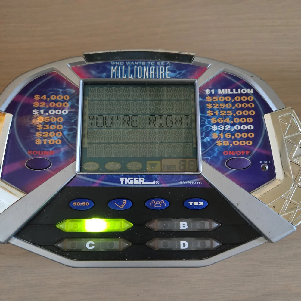 Vtg Who Wants To Be A Millionaire Handheld Electronic LCD Tiger Game Tested Work